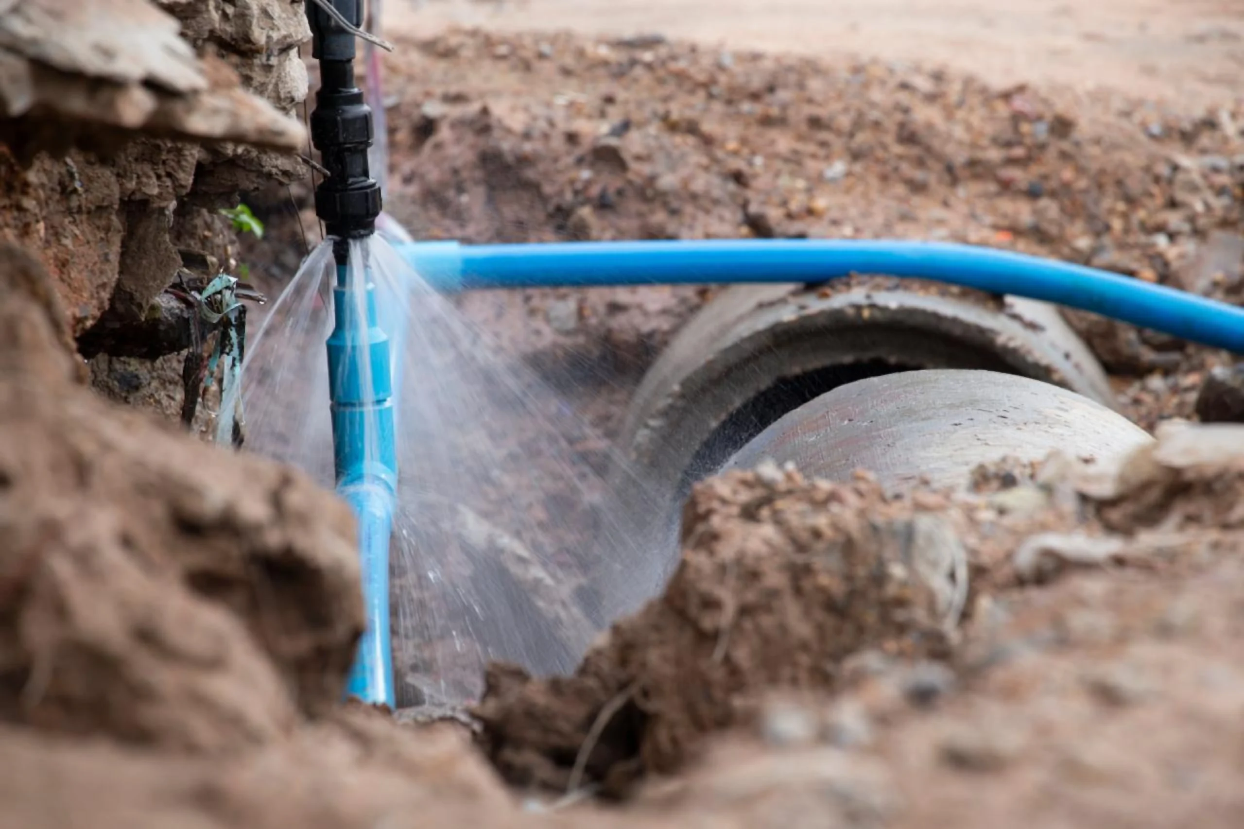 Burst underground water pipe leaking water in Emerald, Queensland.