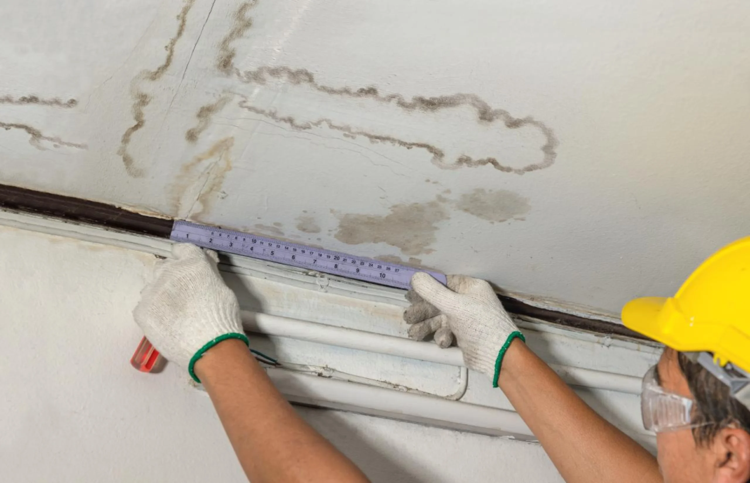 Roof plumber inspecting water damage and possible roof leak in Emerald, Queensland.